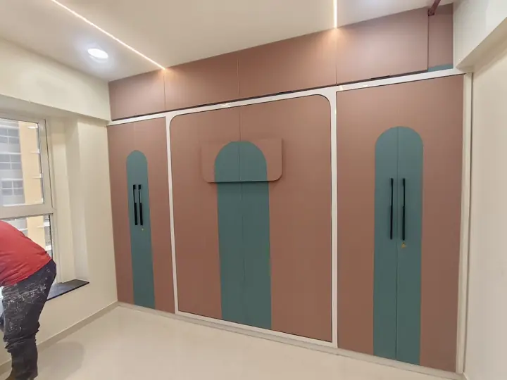 Pastel wardrobe with arched handles – VS Interiors, Wagholi