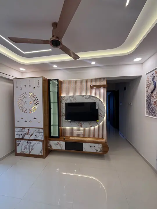 Living room with pooja unit, TV wall and cove-lit false ceiling – VS Interiors, Wagholi