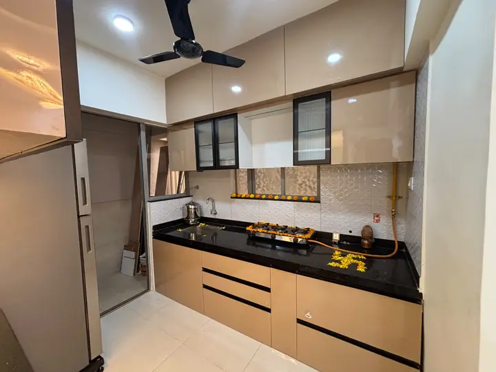 Champagne gloss straight kitchen with black granite top – VS Interiors, Wagholi