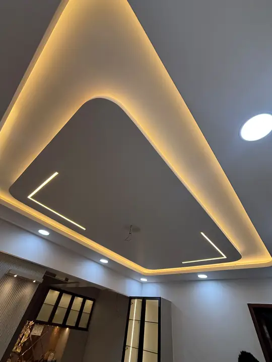 Curved false ceiling with warm cove light and linear lights – VS Interiors, Wagholi