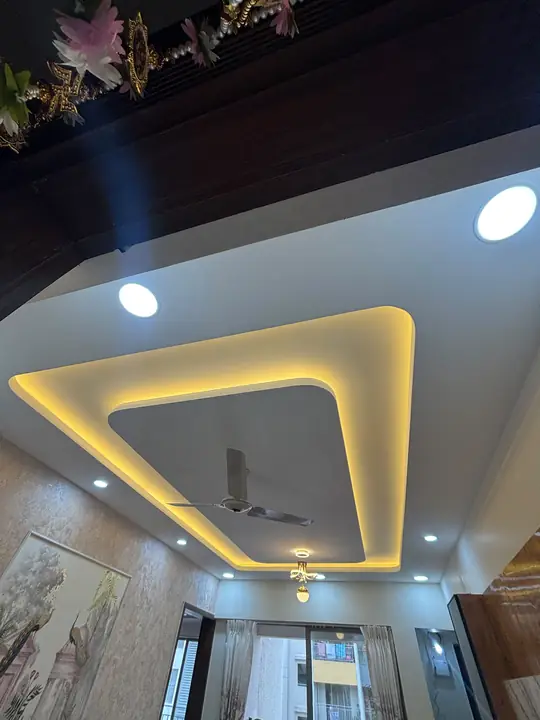 Living room false ceiling with golden cove lighting – VS Interiors, Wagholi