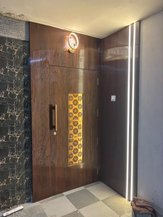 Main door with wooden cladding, jaali inlay and LED strips – VS Interiors, Wagholi